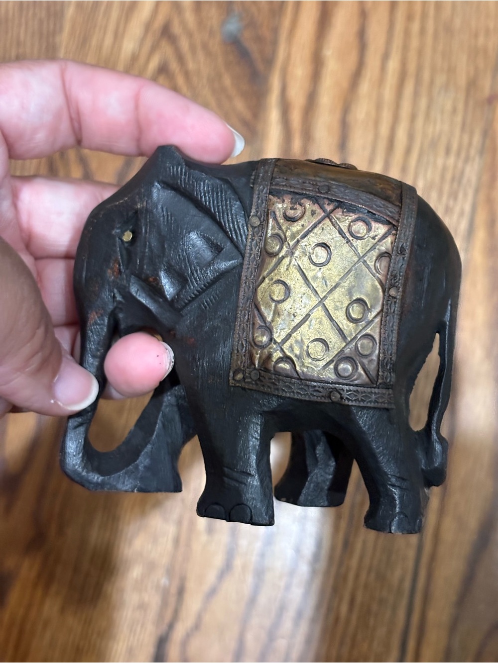 Black Wooden Elephant Figurine with Gold Saddle Accent
